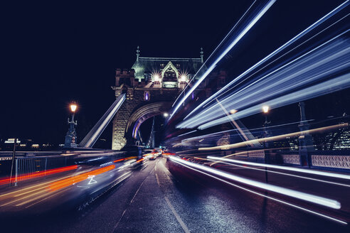Light trails at Tower Bridge against clear sky at night - CAVF60627