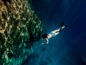 Barracuda Lake, Coron Island, Palawan, Philippines, woman diving - DAWF00735