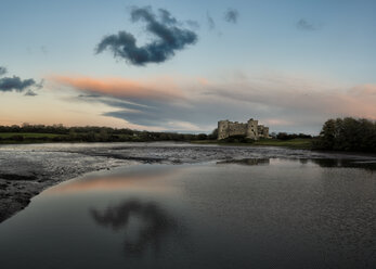 United Kingdom, Wales, Pembrokeshire, Carew Castle and Carew River in the evening - ALRF01367