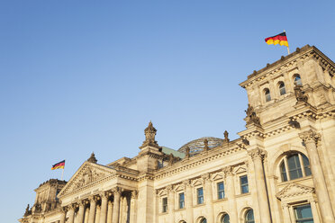 Germany, Berlin, Reichstag building and German flags - GWF05708