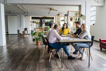 Business team having a meeting in loft office - GIOF05180