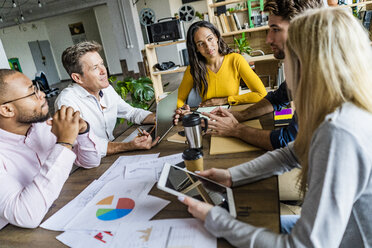 Business team having a meeting in loft office - GIOF05181