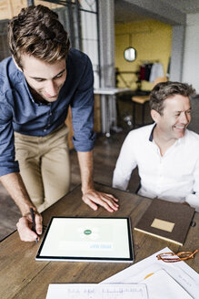 Two businessmen during a meeting in loft office - GIOF05193