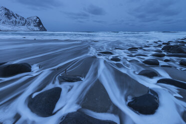 Rocks on beach in winter, Unstad beach, Vestvagoya, Lofoten Islands, Norway - AURF07915