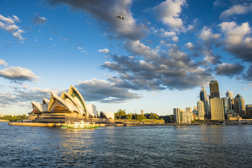 Australia, New South Wales, Sydney, Business district and Sydney Opera House in the evening light - RUNF00529