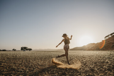 Namibia, Namib desert, Namib-Naukluft National Park, Sossusvlei, woman moving at sunset at Elim Dune - LHPF00231