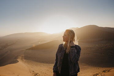 Namibia, Namib desert, Namib-Naukluft National Park, Sossusvlei, woman Dune 45 at sunrise - LHPF00241