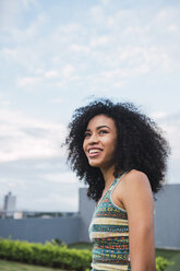 Portrait of smiling young woman outdoors - KKAF03104