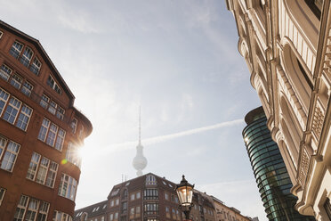 Germany, Berlin, buildings at Rosenthaler Strasse with television tower in the background at morning - GWF05721