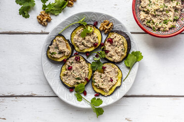 Baked aubergine slices spread with walnut creme garnished with pomegranate seeds - SARF04031