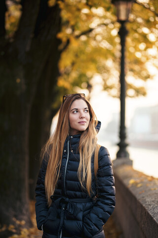 Italy, Verona, portrait of young woman in autumn stock photo