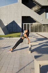 Young woman doing workout exercise in the city - MAUF02162