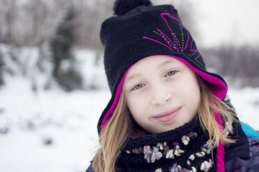 Outdoor portrait of girl in warm winter clothing - AURF08132