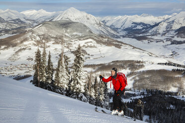 Woman skiing up hill, Crested Butte, Colorado, USA - AURF08160