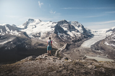 Hiker admiring scenic mountains, Alberta, Canada - AURF08219