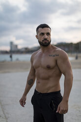 Portrait of barechested muscular man outdoors - MAUF02219