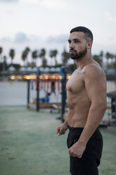 Portrait of barechested muscular man outdoors - MAUF02228