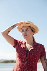 Portrait of tattooed young woman on the beach - LOTF00019