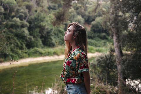 Young woman surrounded by nature stock photo