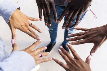 Friends touching with fingers of their hands, making a star shape - GIOF05374