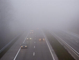 Cars on motorway in fog - WWF04753