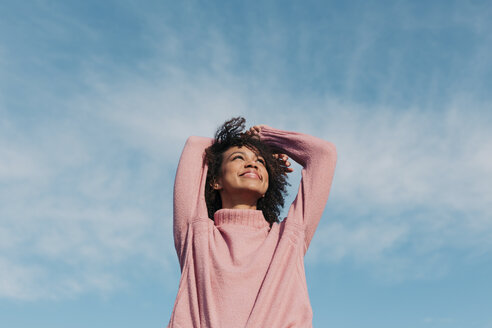 Portrait of happy young woman enjoying sunlight - LOTF00034