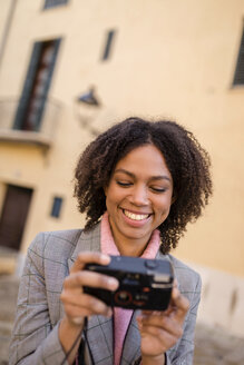 Portrait of laughing young woman looking at camera - LOTF00049