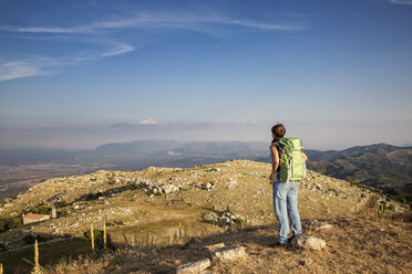 Greece, Peloponnese, Arcadia, Lykaion, woman enjoying the view from mountain Profitis Ilias - MAMF00327