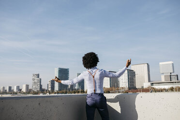 Spain, Barcelona, back view of dancing man - JRFF02432