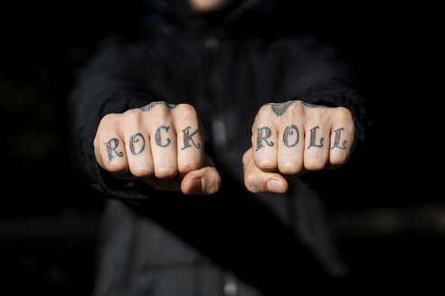 Man showing his tattooed hands, close-up - XCF00183