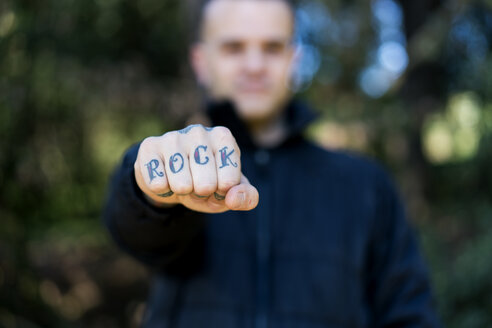 Man showing his tattooed hand, close-up - XCF00186