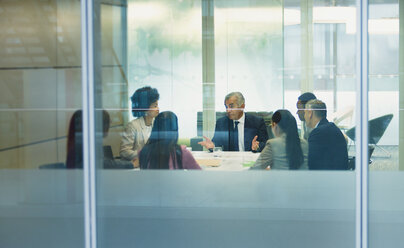 Businessman talking in conference room meeting - HOXF04272