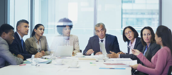 Business people talking in conference room meeting - HOXF04288