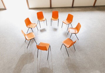 Circle of chairs ready in community center - CAIF22510