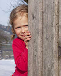 Girl behind wooden wall - WWF04789