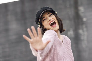 Portrait of posing young woman wearing cap - JSMF00722