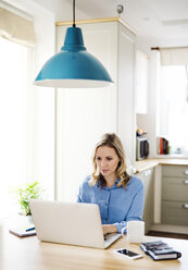 Woman with laptop working at home - HAPF02849