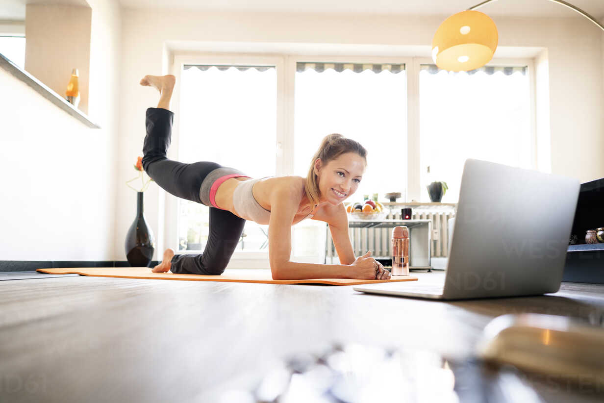 Free Stock Photo of Women doing online yoga at home