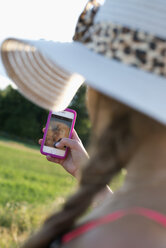 Girl taking selfie in Smaland, Sweden - FOLF09619