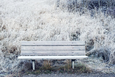 Wooden bench in snow in Sweden - FOLF09656