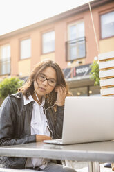 Young woman using her laptop in Solvesborg, Sweden - FOLF09742