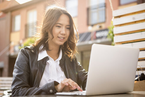 Young woman using her laptop in Solvesborg, Sweden - FOLF09743