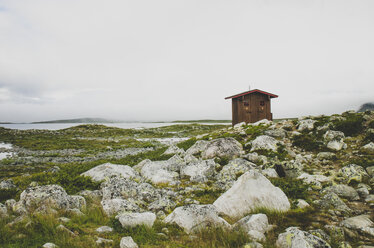 Hut in field by rocks in Enontekio, Finland - FOLF09876