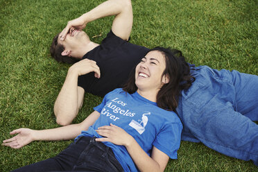 Couple laughing in a park in Copenhagen - FOLF09938