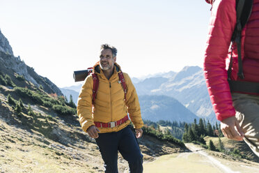 Austria, Tyrol, smiling man with woman hiking in the mountains - UUF16336