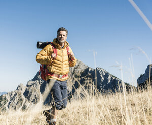 Austria, Tyrol, man hiking in the mountains - UUF16378