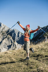 Austria, Tyrol, cheerful woman on a hikig trip in the mountains - UUF16410