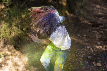 Boy full of colorful powder paint, celebrating Holi, Festival of Colors - ERRF00456
