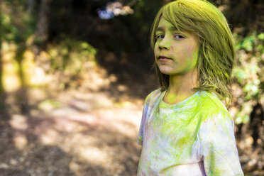 Boy full of colorful powder paint, celebrating Holi, Festival of Colors - ERRF00482