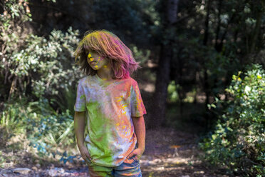 Boy full of colorful powder paint, celebrating Holi, Festival of Colors - ERRF00494